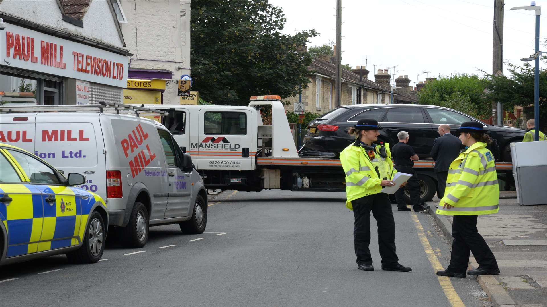 A car is towed away from the scene