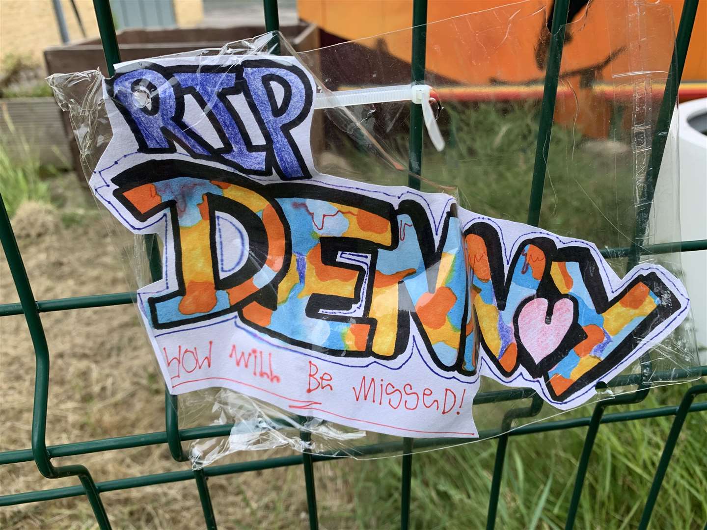 Artwork in Alex Denny's memory has been tied to the fence