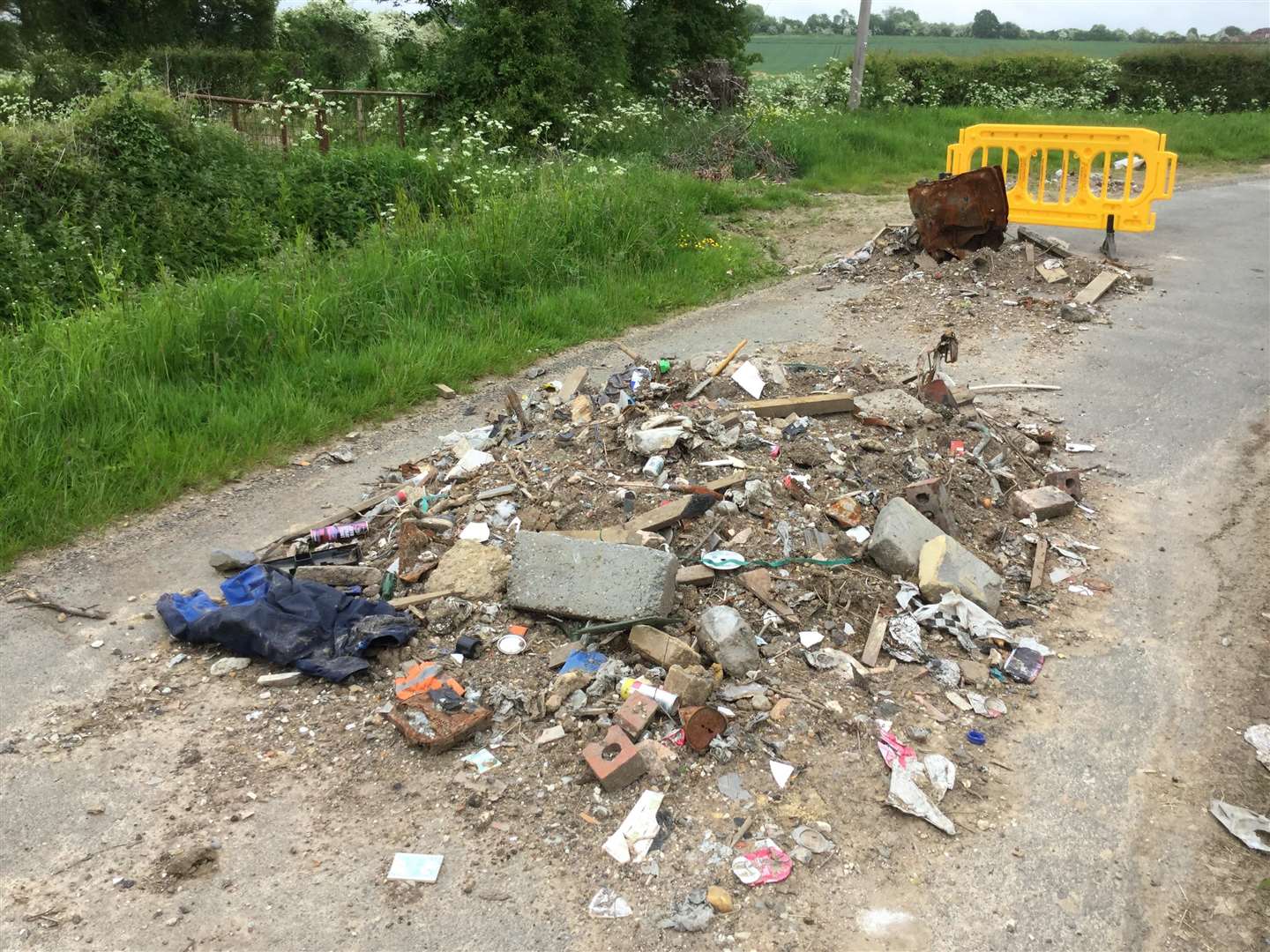 The debris dumped on Chilmington Green Lane