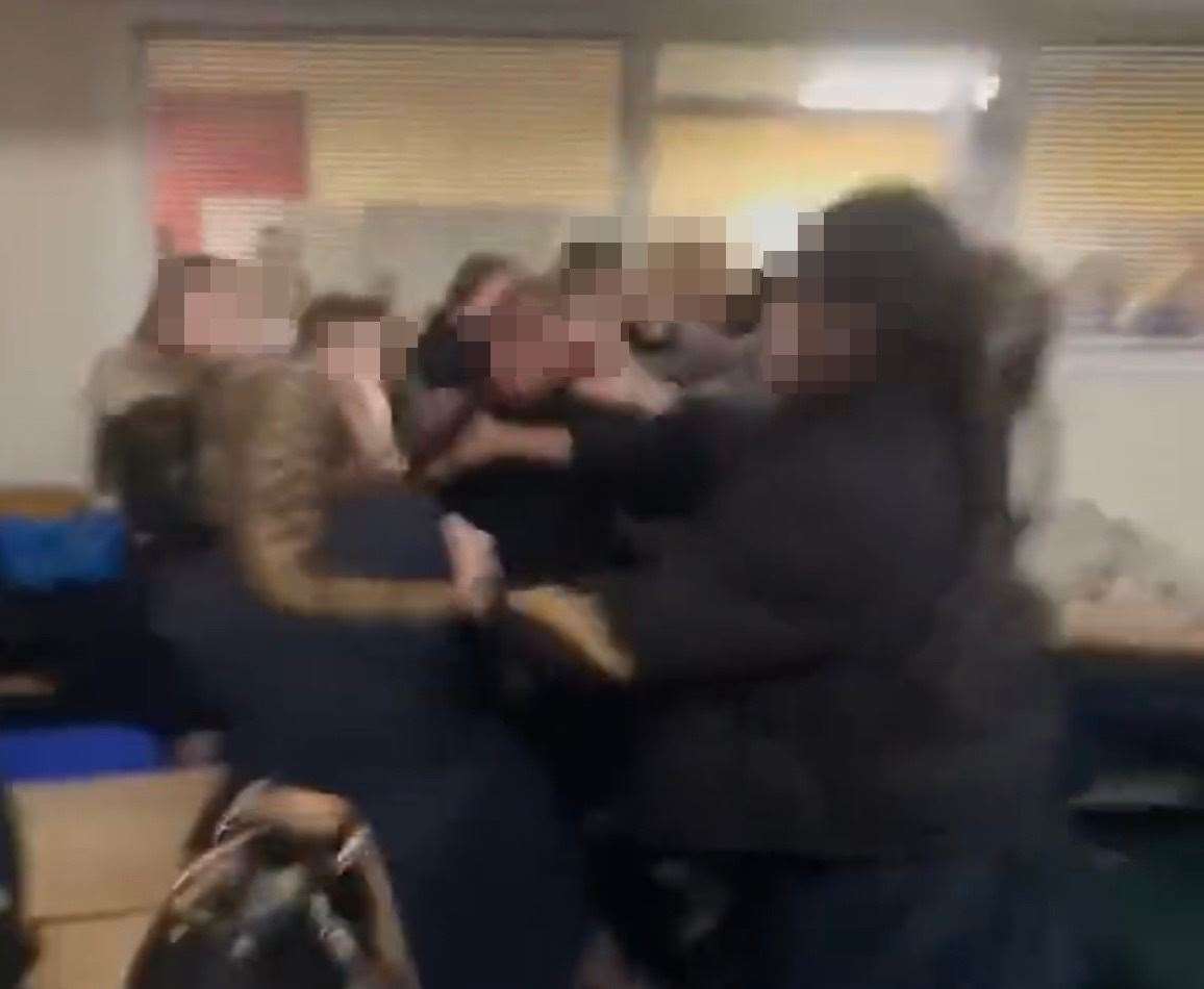 Dozens of students can be seen in the room while a brawl erupts. Picture: Twitter/@georgiiee_xo
