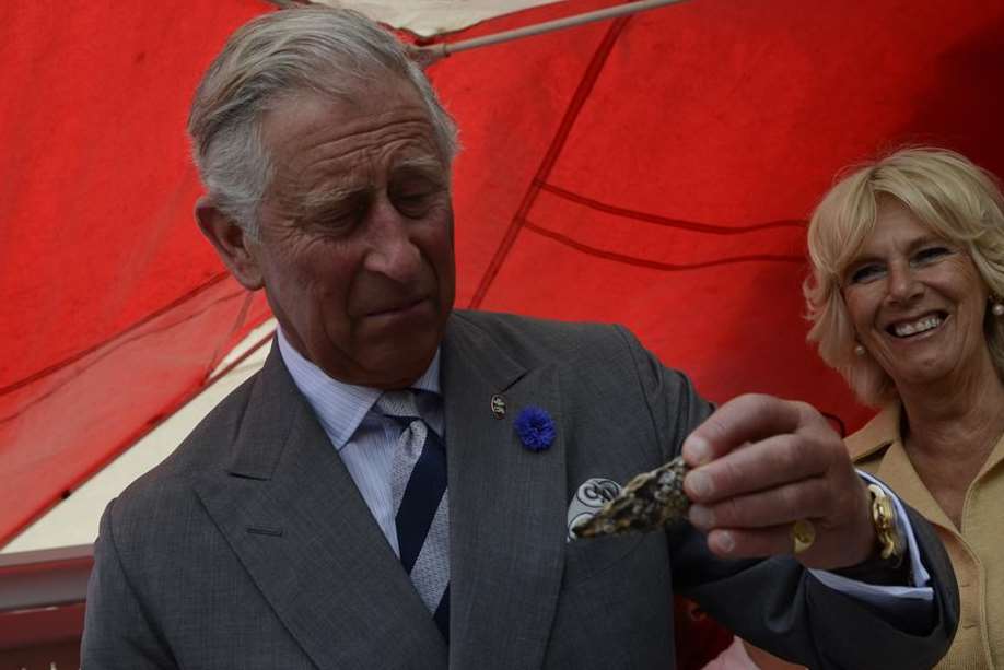 Prince Charles eyes an oyster at West's Welks in Whitstable. Picture: Gary Browne