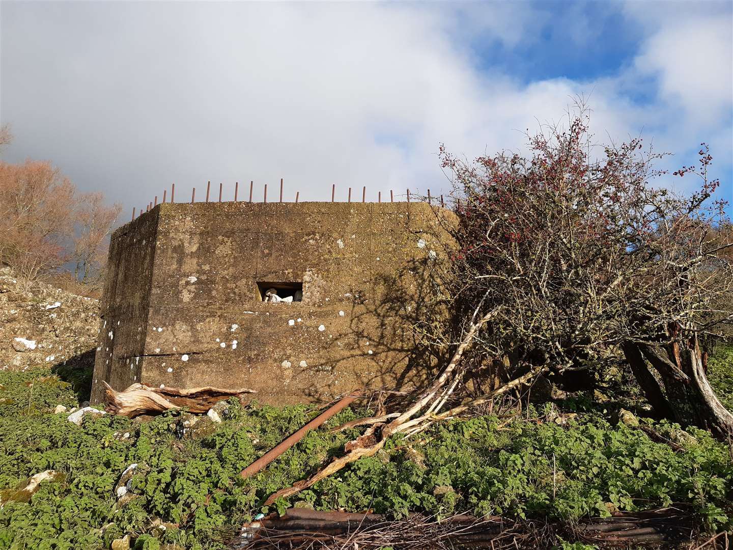 A Second World War pillbox is attached to the front of the chapel