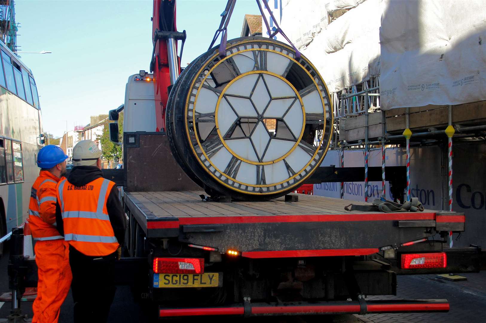 The giant Victoria timepiece carefully lowered onto a lorry to be taken for restoration. Picture: Dover District Council