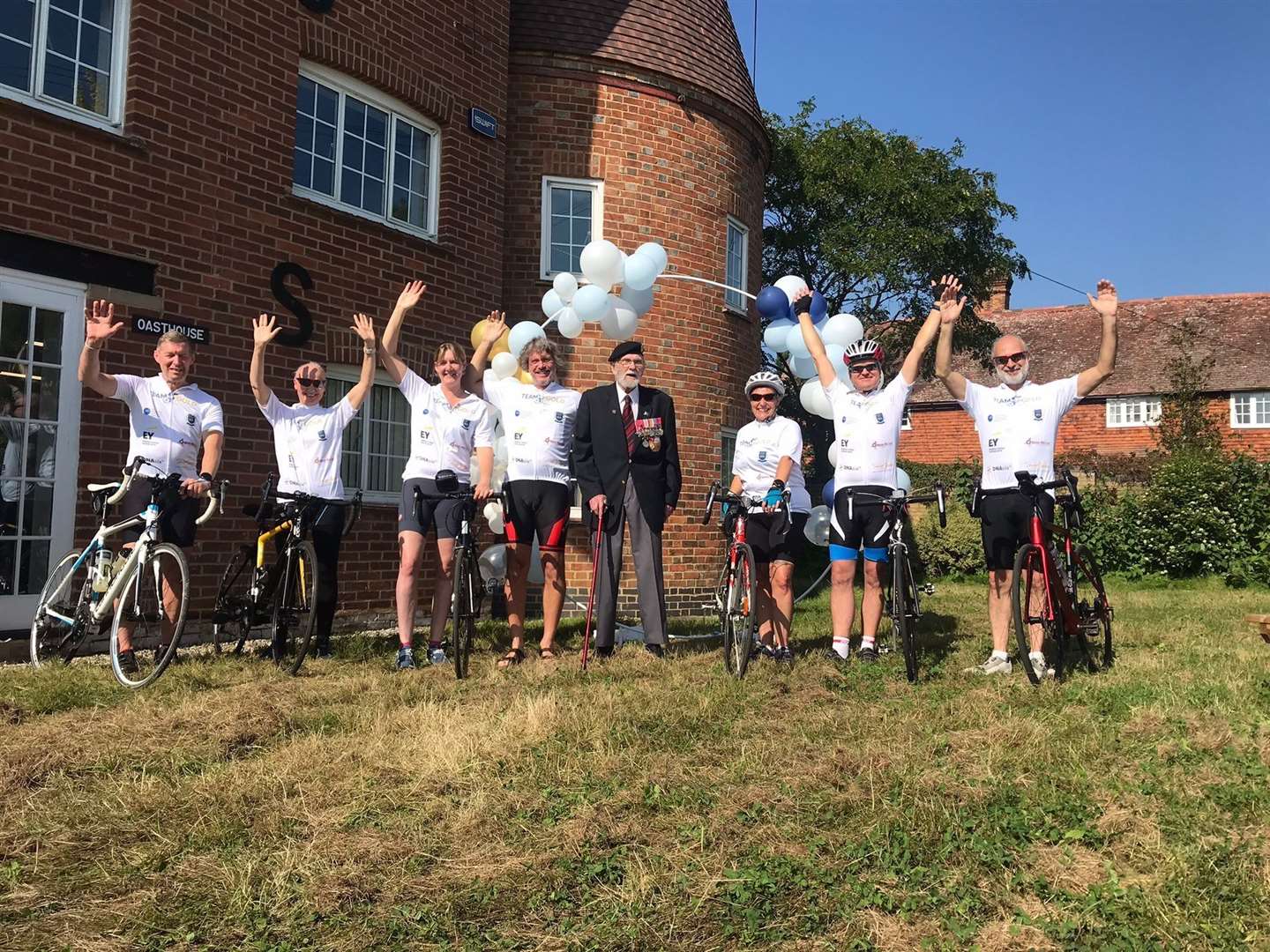 George Batts waves off the seven intrepid cyclists from the International Association of Bookkeepers