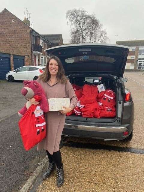 Upchurch Support Network led by mum-of-two Cia Merrall, pictured, has donated 60 Christmas stockings to families with help from her two sons, Ted, four, and Kit, two, and volunteer Amy Fernando