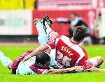 Grant Basey is brought down. Picture: Barry Goodwin