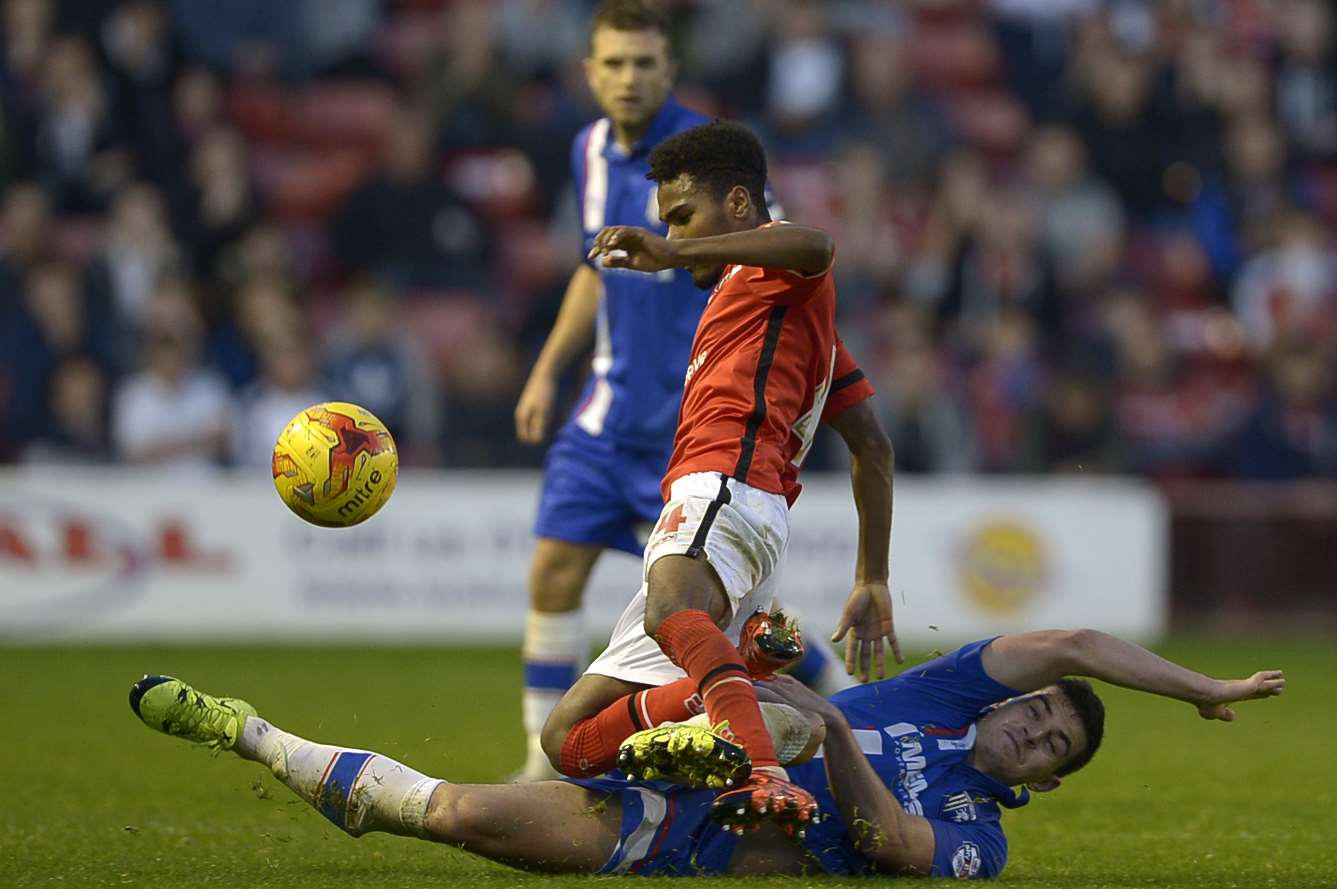 John Egan denies Walsall's Rico Henry at the Bescot Stadium, but Gills couldn't hold on to their two-goal advantage Picture: Barry Goodwin