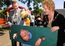 SureStart Sheerness director John Fowler gets a dunking from Mayor and Mayoress of Swale Cllr Adrian Crowther and Mrs Pamela Berry