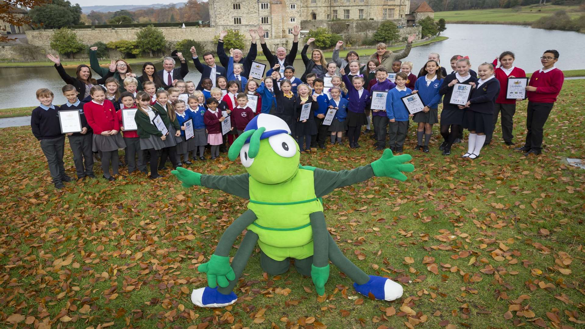 All winners, supporters, and mascot Buster Bug at walk to school and literacy challenge winners presentation at Leeds Castle, Maidstone.