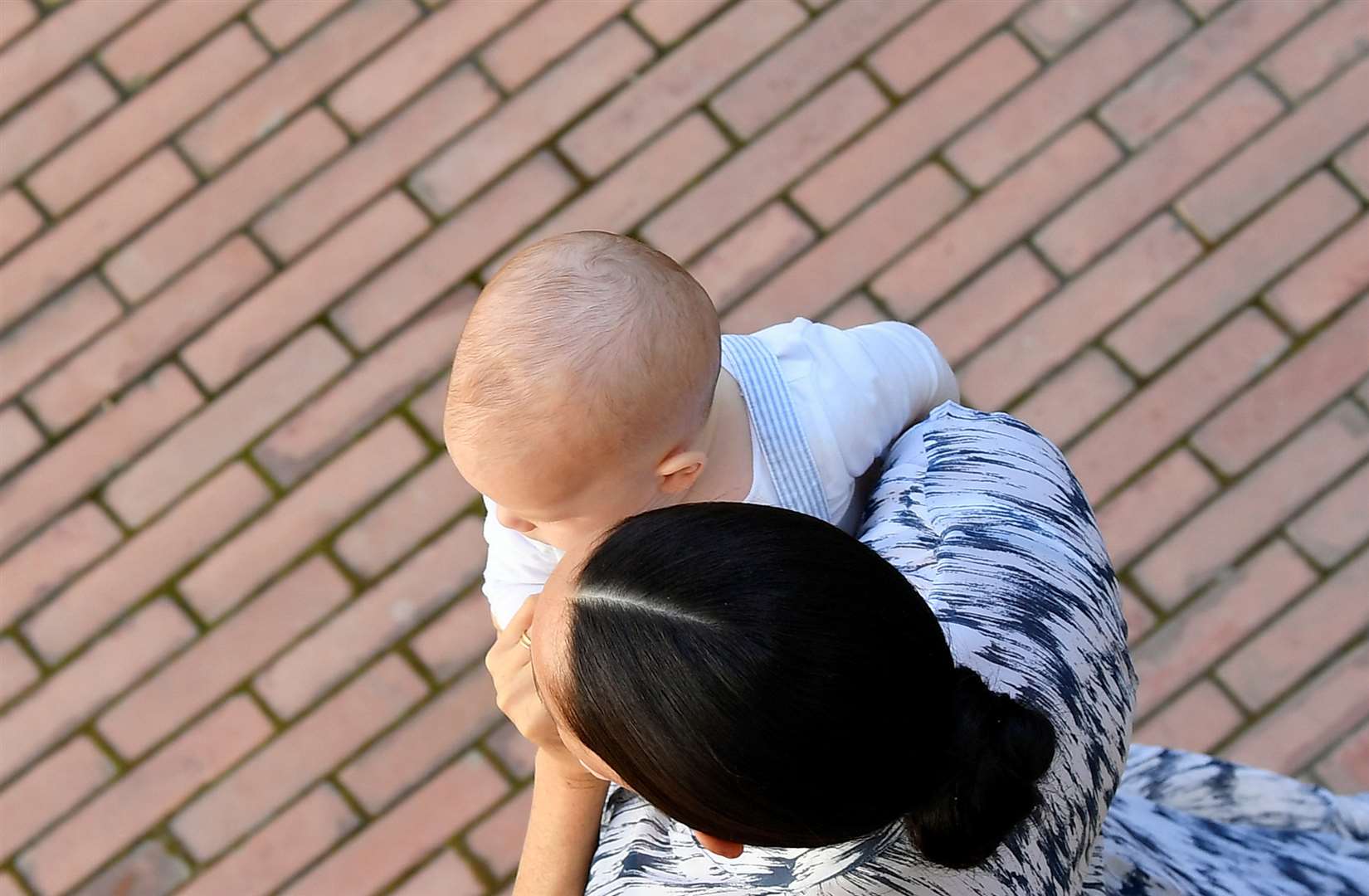 Meghan holding Archie in South Africa (Toby Melville/PA)