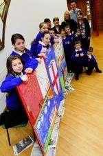 Pupils and staff of St Georges Primary School, Minster, with members of the Friends of Lovell Road and the mural