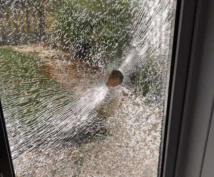 The window was shattered on Oak Tree Road in Ashford