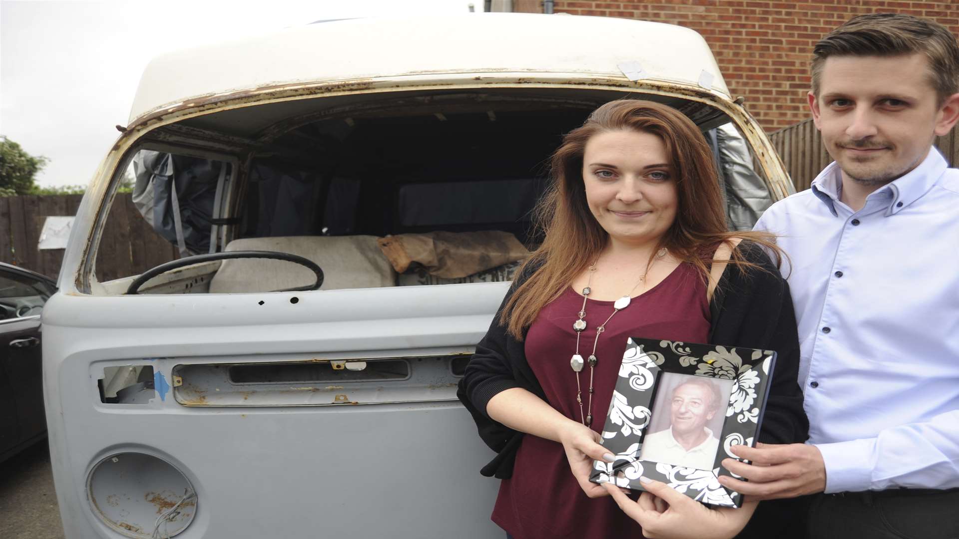 Emma Wyre and Billy Green with their camper van which will take centre stage at their wedding