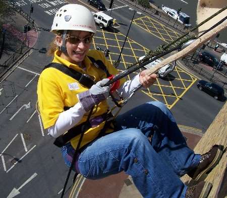 An abseiler from one of the event sponsors, Vertex Law. Picture by Simon Dolby