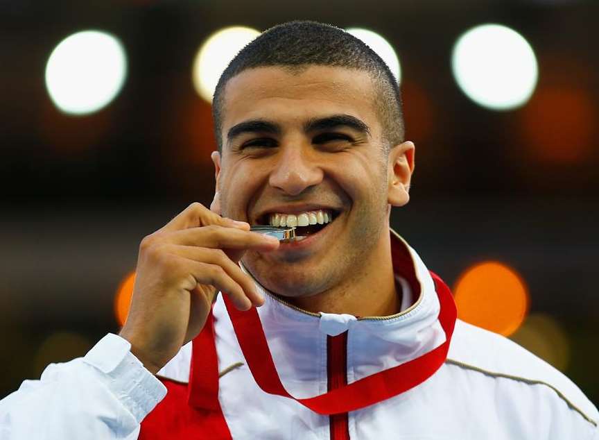 Adam Gemili collects his 100m silver medal. Picture: Clive Rose/Getty Images