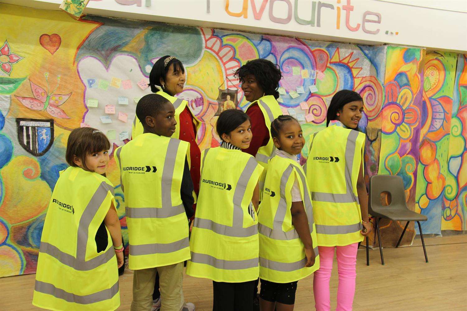 Hi-vis jackets have been given to children from an engineering firm to help teach them about the importance of safety.