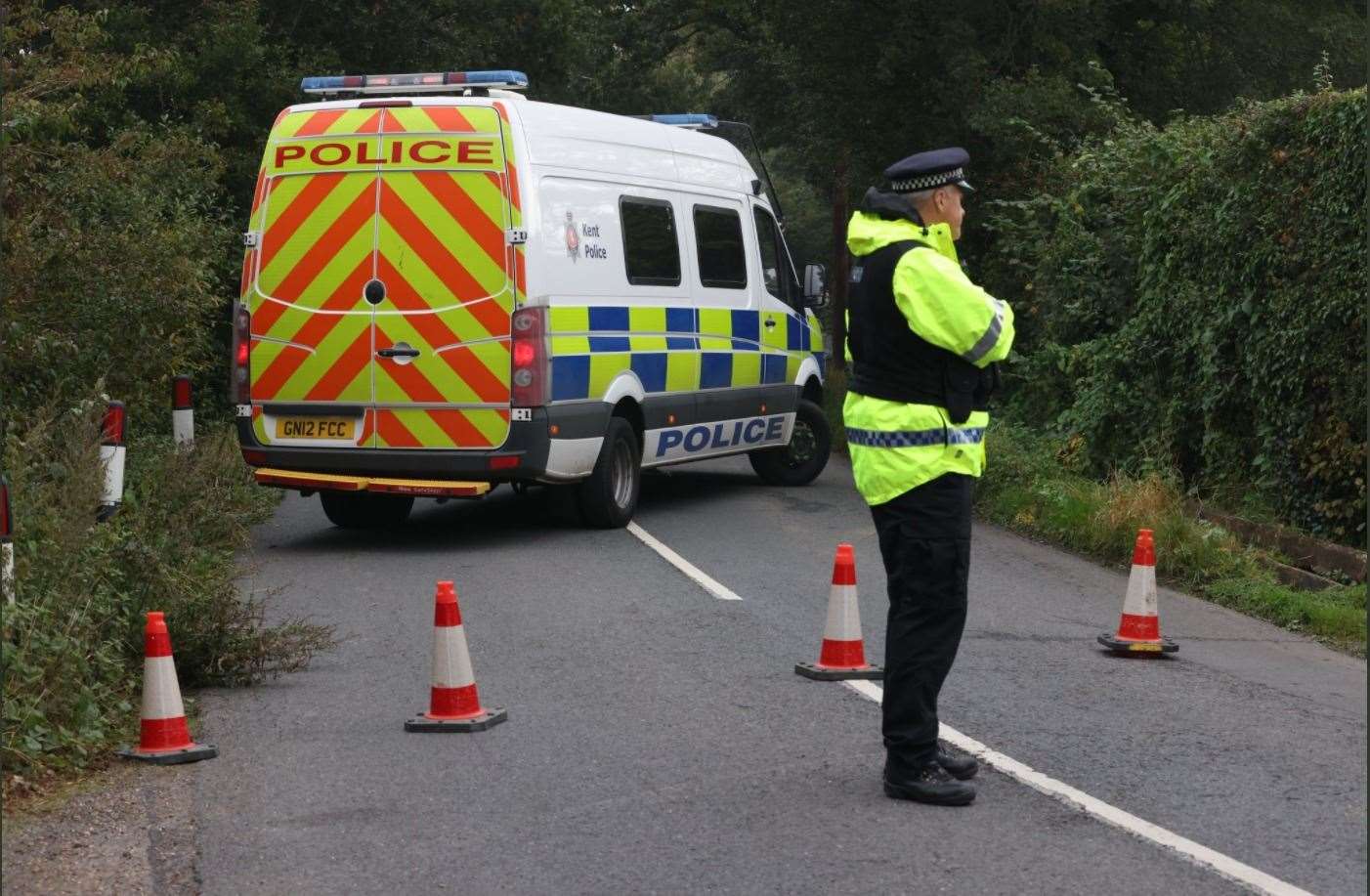 Police attend the scene of a crash in Lenham Road, Headcorn Picture: UKNIP