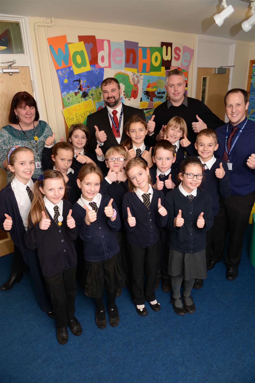 Principal Graham Chisnell, deputy principal Anne-Marie Middleton, senior teachers Rob Hackett and Adam Atkinson and pupils give the report a thumbs up
