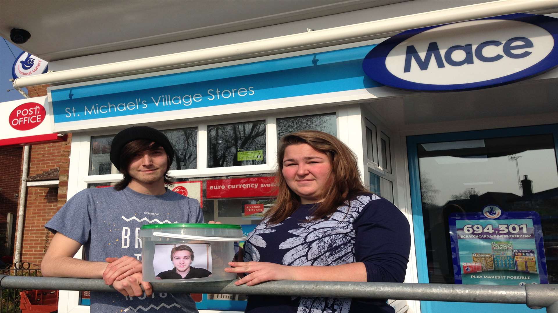 Aidan Levett and Amy Haffenden, friends of Jason Pettey, with a collection box for a memorial to him at St Michael's Post Office