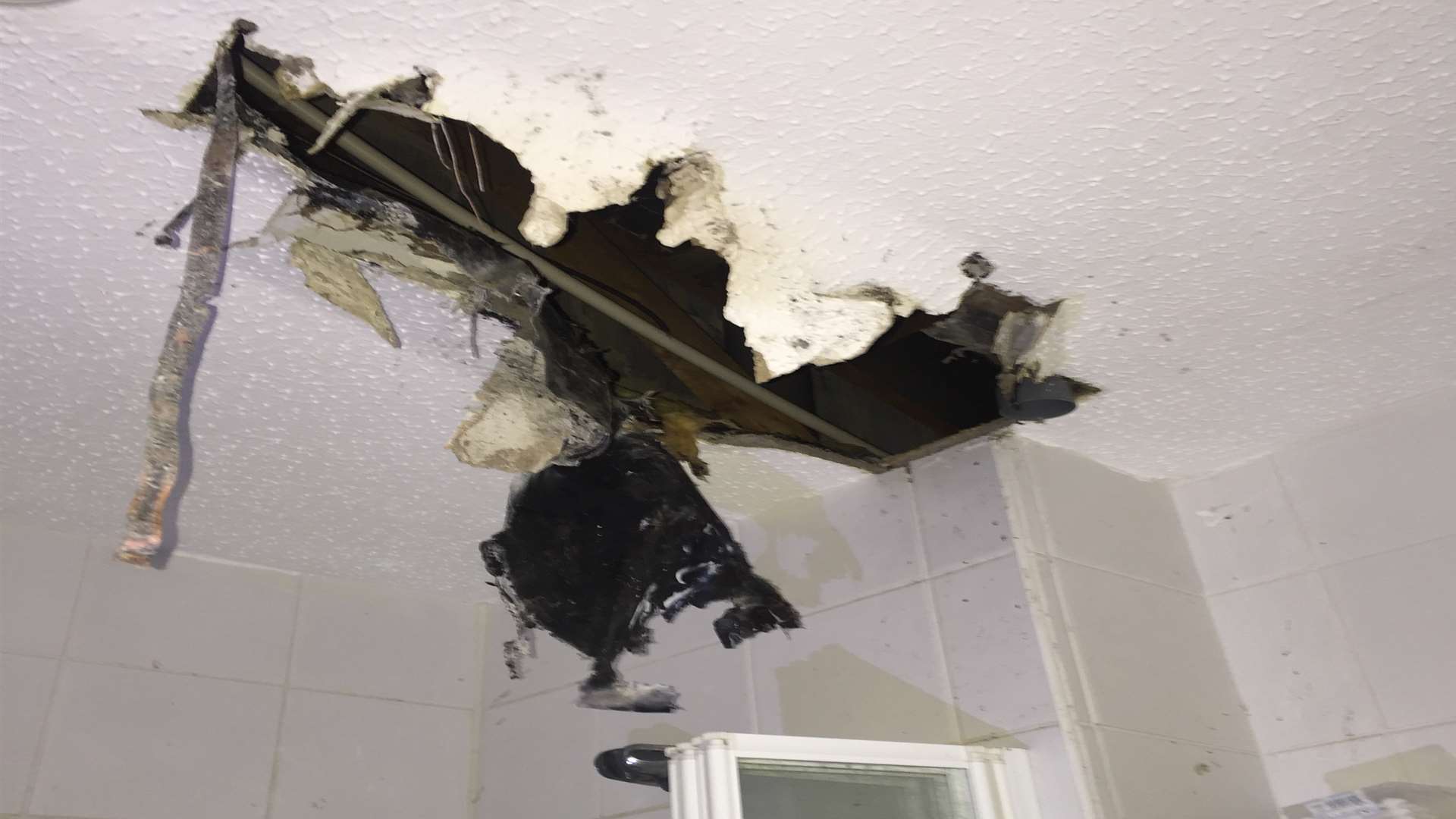 The ceiling Scott Baker's bathroom fell through after a blaze in Bazes Shaw, New Ash Green