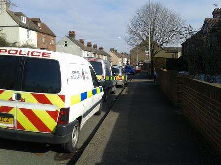 Police outside of the house in Sittingbourne where a body was found.