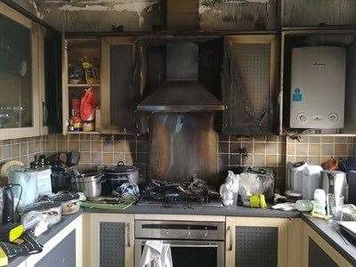 A mum's kitchen was left badly damaged after a fire began when a steriliser was left on the hob