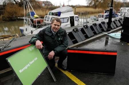 Paul Marshall from the Environment Agency testing new demountable flood defences at Sandwich Quay