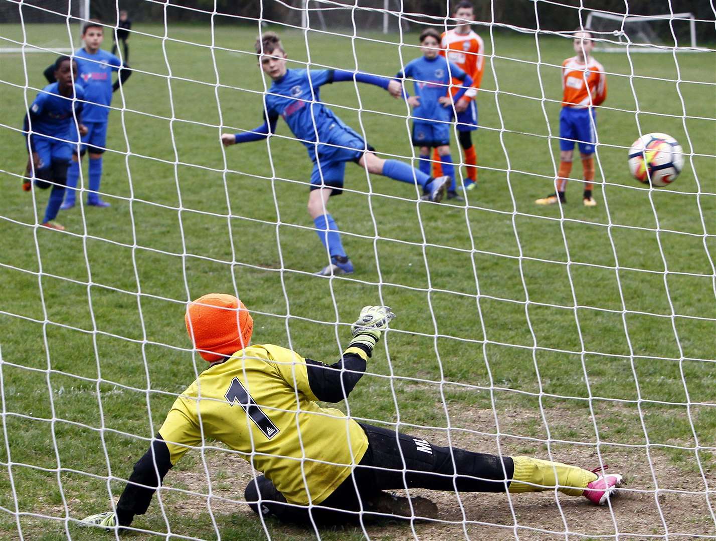 Medway United North under-12s' Harry Egan scores from the penalty spot against Cuxton Cobras under-12s. Picture: Sean Aidan FM8161211