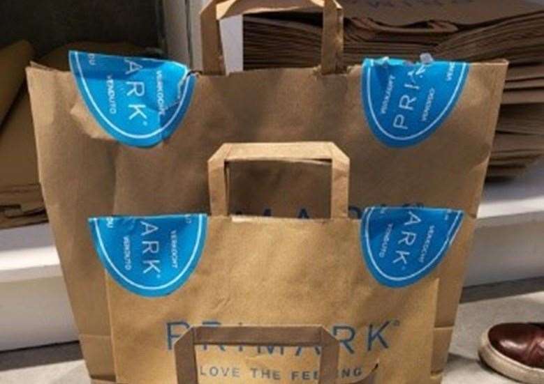 Primark is trailing adding blue stickers to bags in some stores. Picture: Primark.