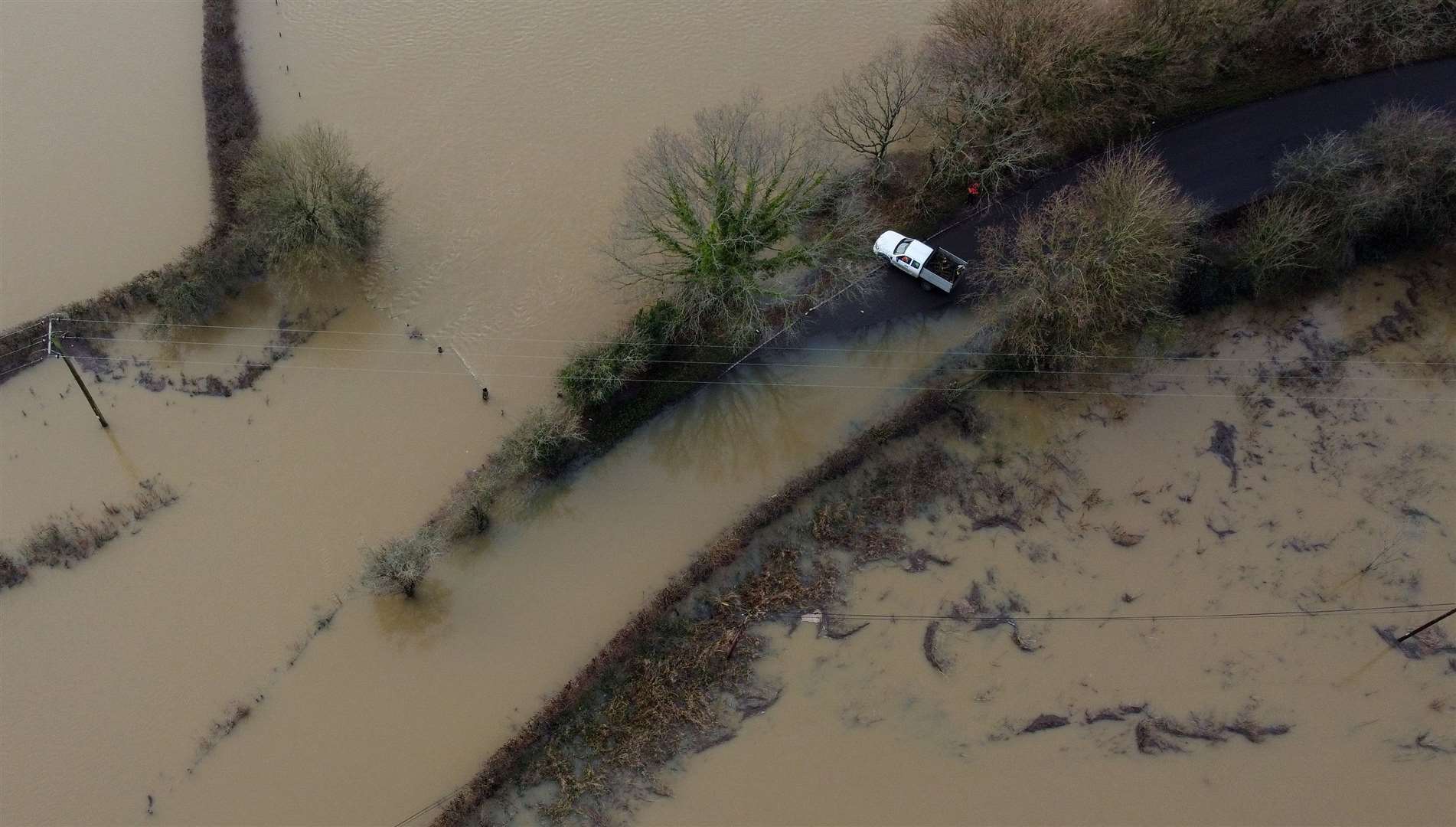 A van avoids flood water from the River Ouse in Barcombe Mills, East Sussex. (Gareth Fuller/PA)