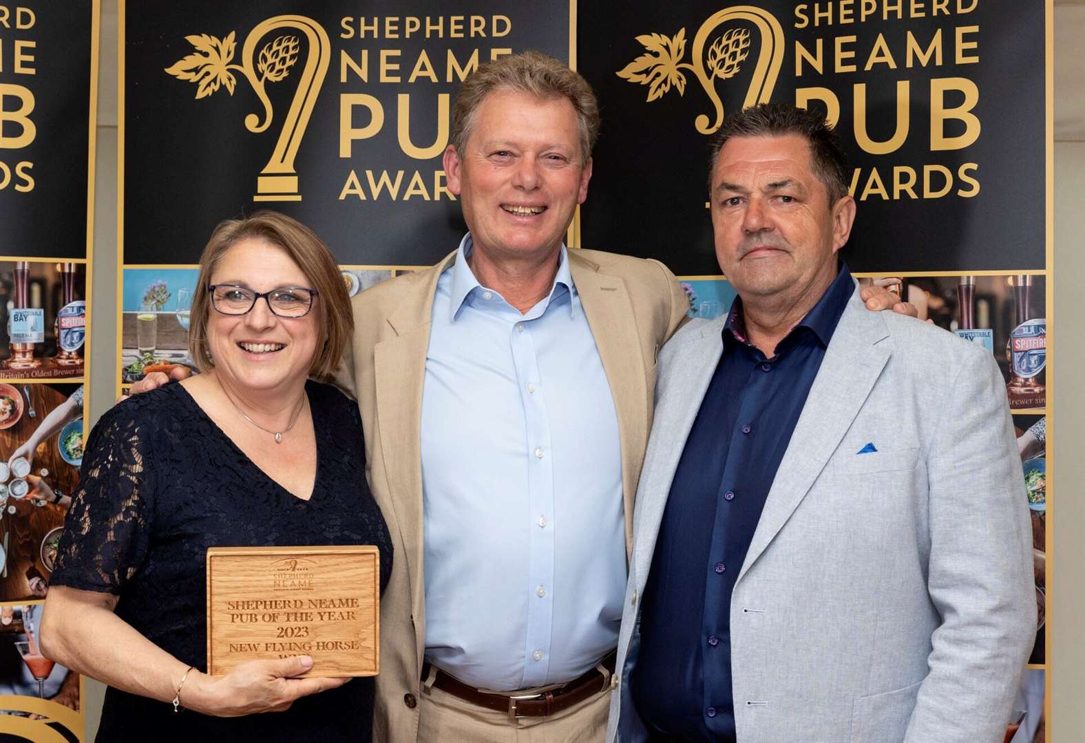 Shepherd Neame Chief Executive Jonathan Neame with Pub of the Year winners Joe and Jane Mullane of the New Flying Horse, Wye. Picture: Shepherd Neame