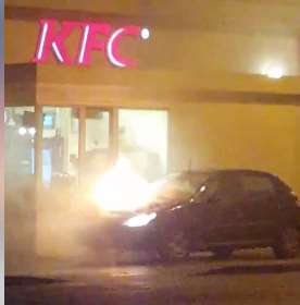 The car on fire outside KFC. Picture courtesy Kieran Cusden
