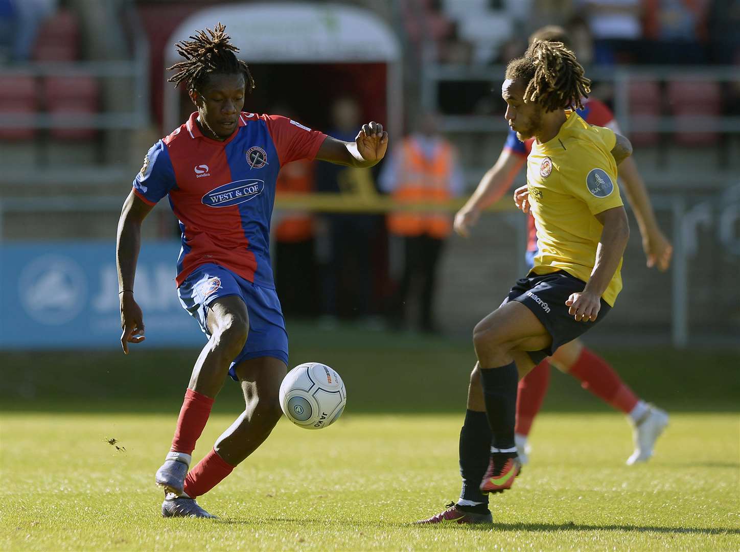 Reise Allassani challenges Dagenham's Alex McQueen Picture: Jimmy Griffiths