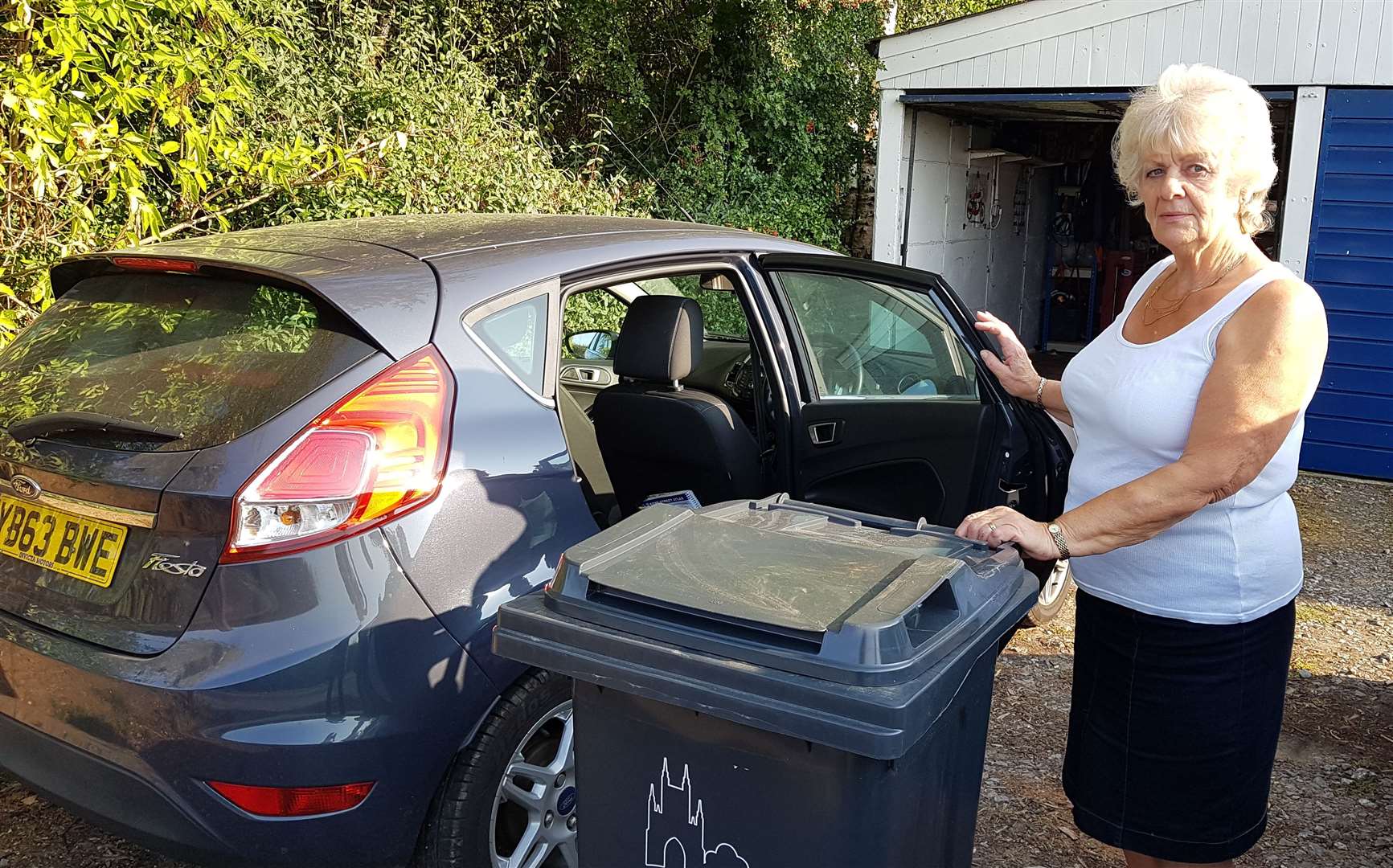 Gill Leith, 72, was told she should pick the wheelie bin up in her Ford Fiesta