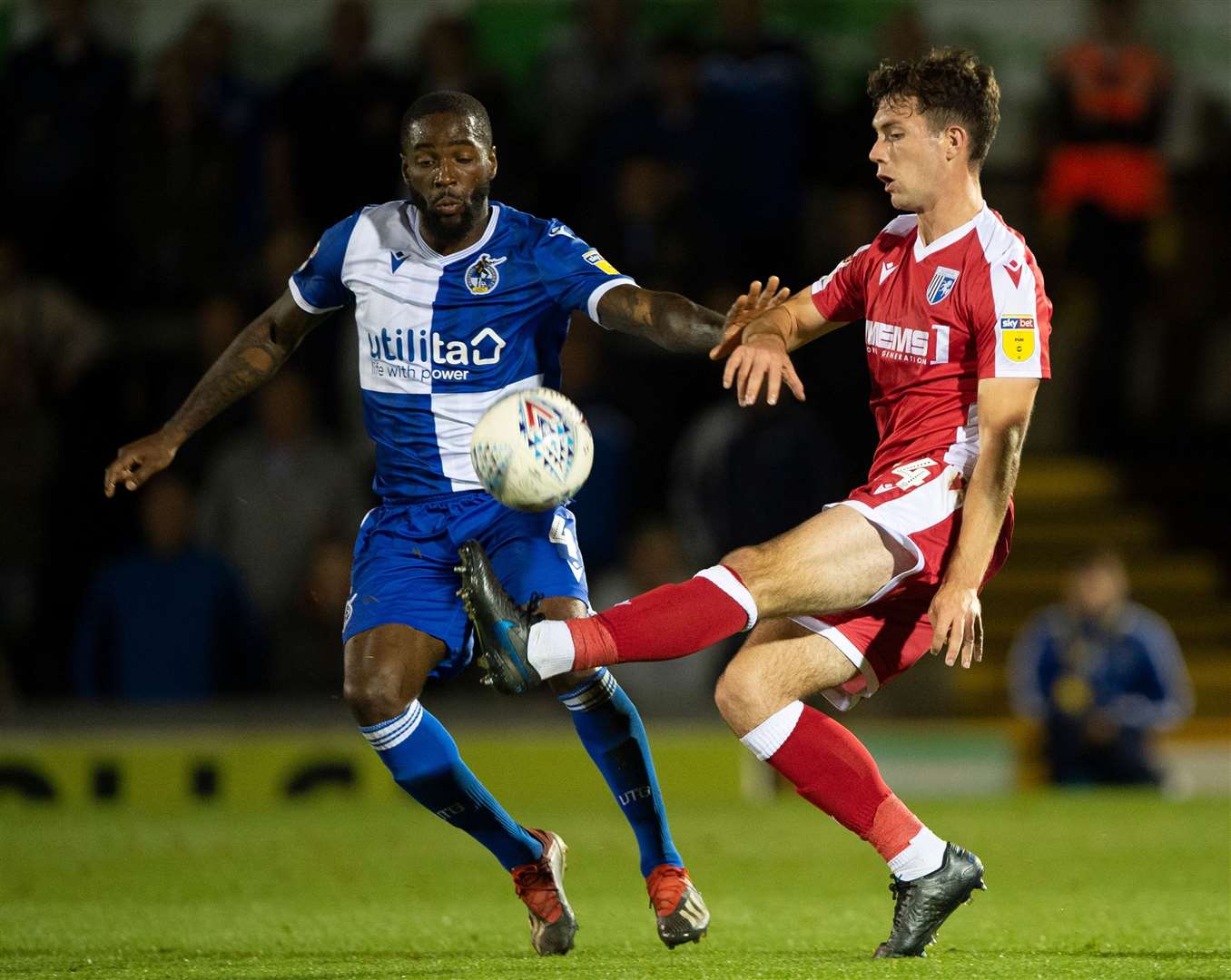 Gillingham's Tom O'Connor r challenges with Abu Ogogo Picture: Ady Kerry