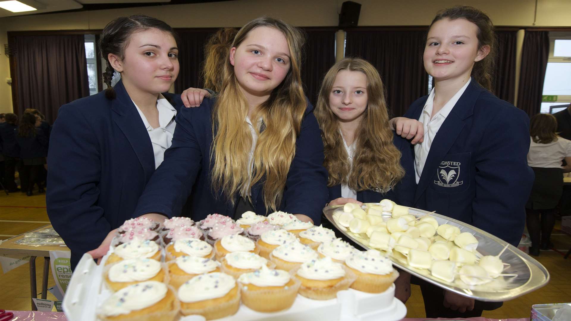 Georgia Bostock, 12, Ella Thorpe, 12, Nicola Crouch, 12, and Shannon Roe, 13, holding some of the tasty treats on offer