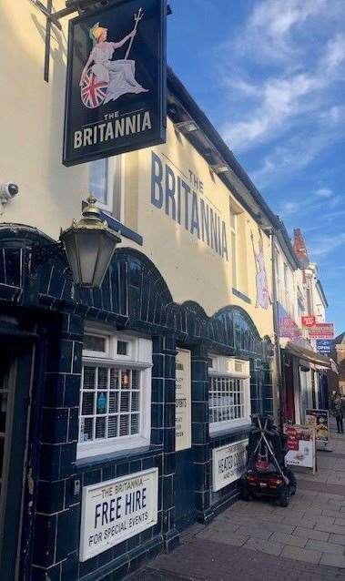 The Britannia, traditionally decorated with dark blue tiles, is not far from the train station on Gillingham High Street