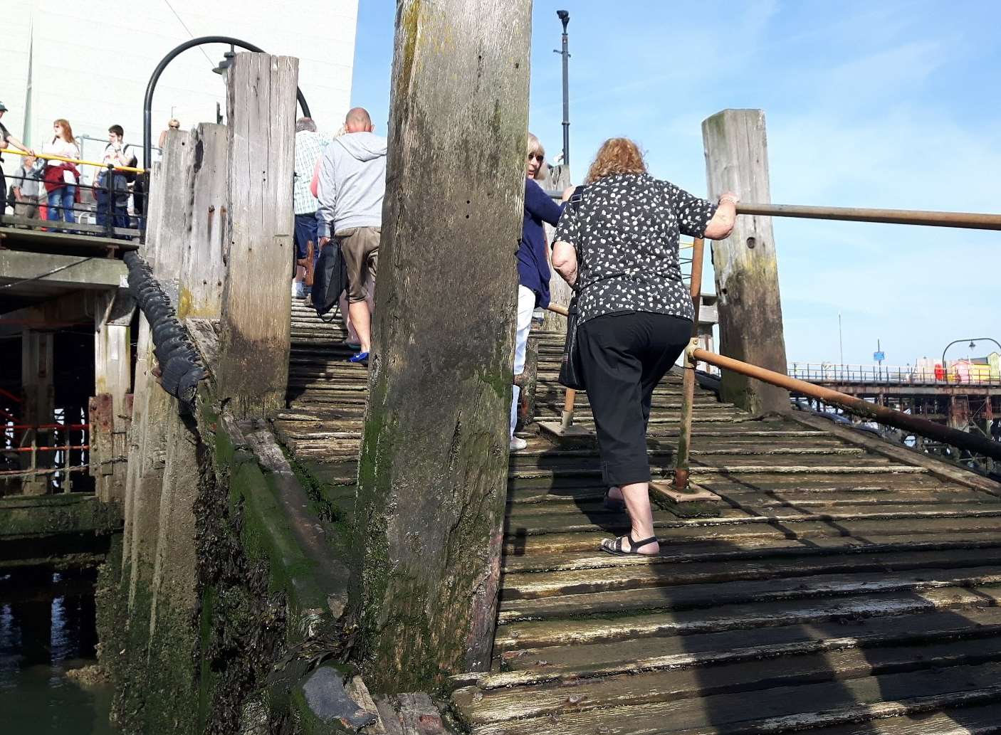 Navigating the steep and slippery gangplank at Southend Pier