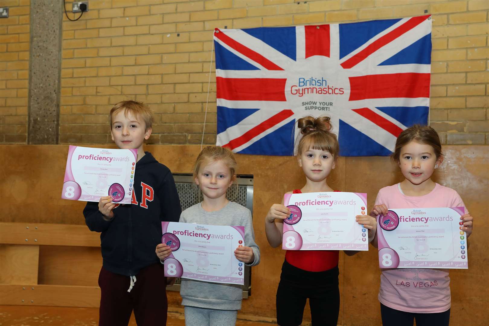 Junior gymnasts from Whiteoak Gymnastics Club poses with their certificates. Picture: Andy Jones.