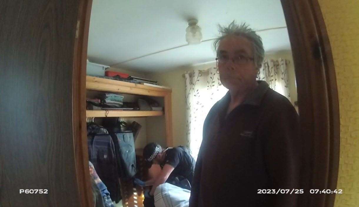 Screengrab taken from body worn camera issued by Norfolk Police of Daniel Lingham as his home is searched (Norfolk Police/ PA)