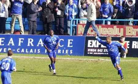 Gillingham's Rod Wallace turns away in celebration after netting the equaliser against Rotherham. Picture: PAUL DENNIS