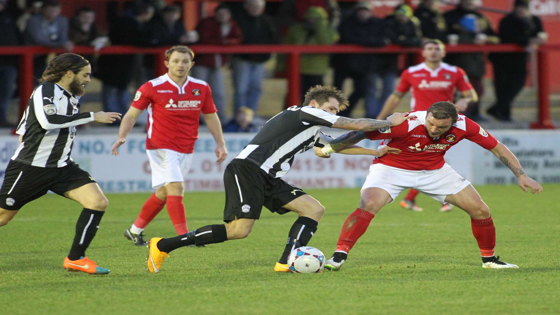 Danny Kedwell in the thick of the action on his Ebbsfleet debut Picture: John Westhrop