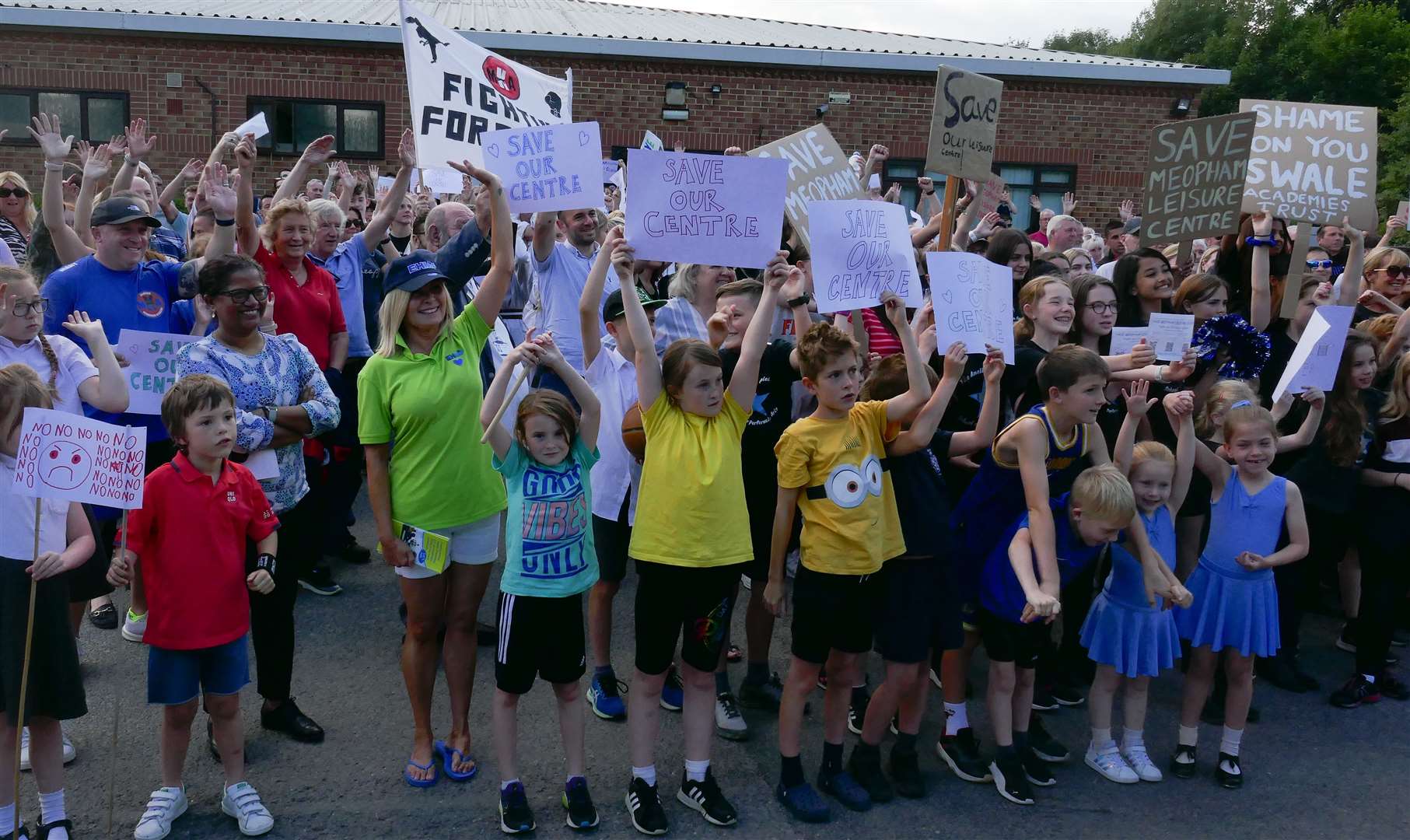 School children joined in the protests and waved placards and posters at Meopham Leisure Centre. Photo: Anna Roberts