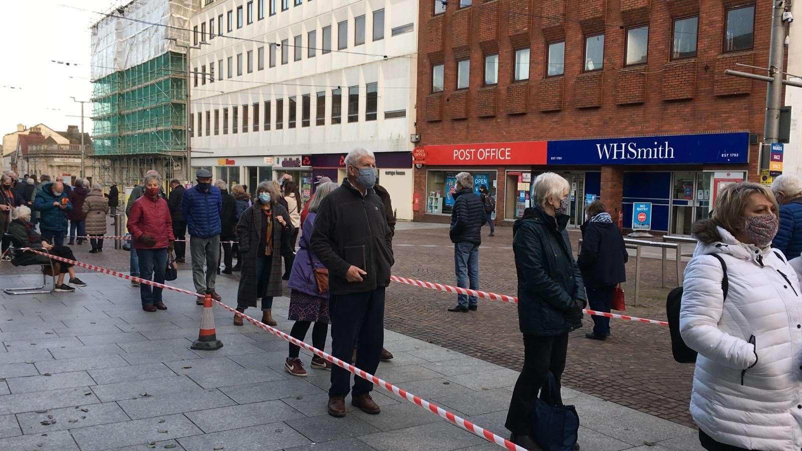 People queuing outside Debenhams in Folkestone waiting for their Covid-19 jab. Picture: Anne Smyth