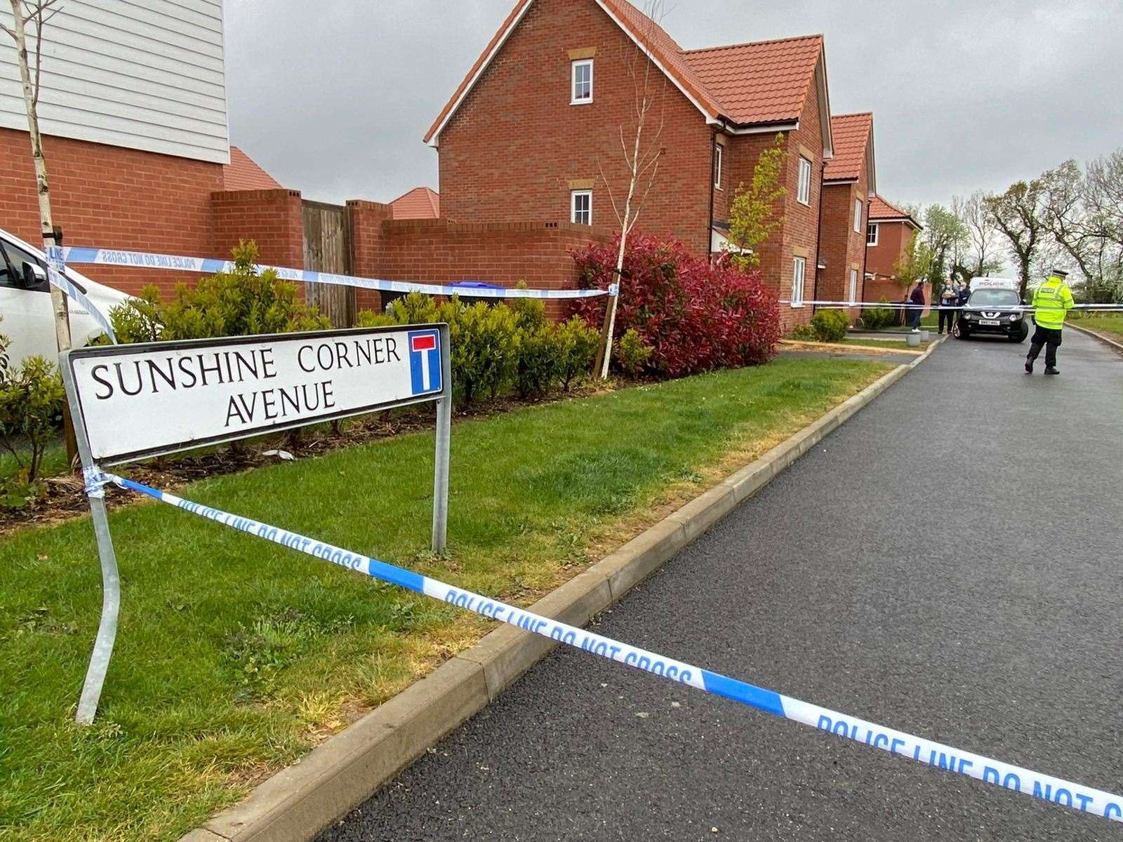 Police and forensics teams search a property in Aylesham in connection with the murder probe