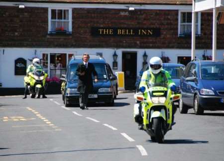 Police motorcyclists escort the funeral cortege to the church for Det Con Andy Eley's funeral