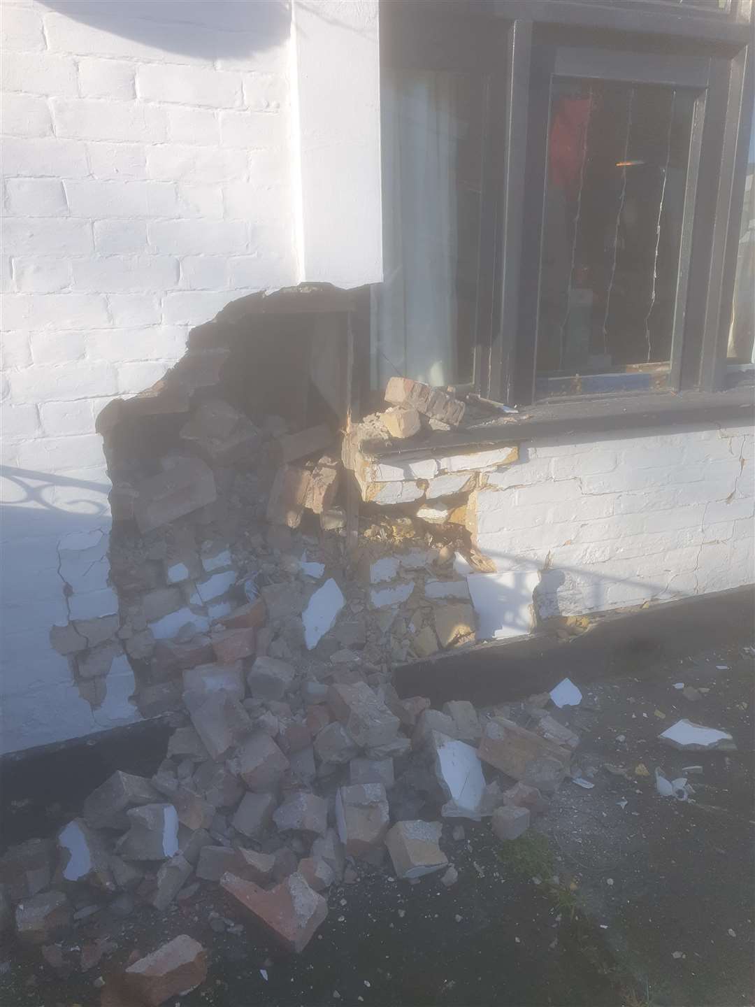 The damage to the front of the pub