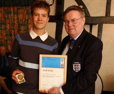 Teenager Jack Gray (left) receives his award from Barry Bright. Picture: BARRY CRAYFORD