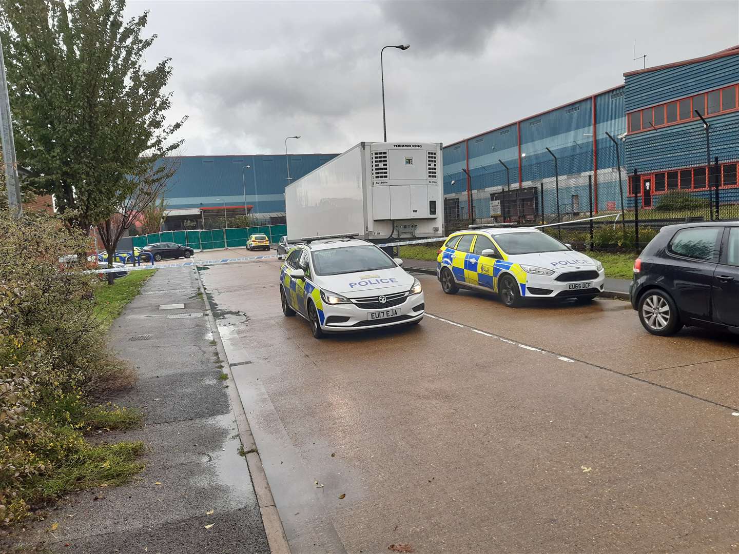 The industrial estate is blocked in both directions by officers from Essex Police. (20075560)