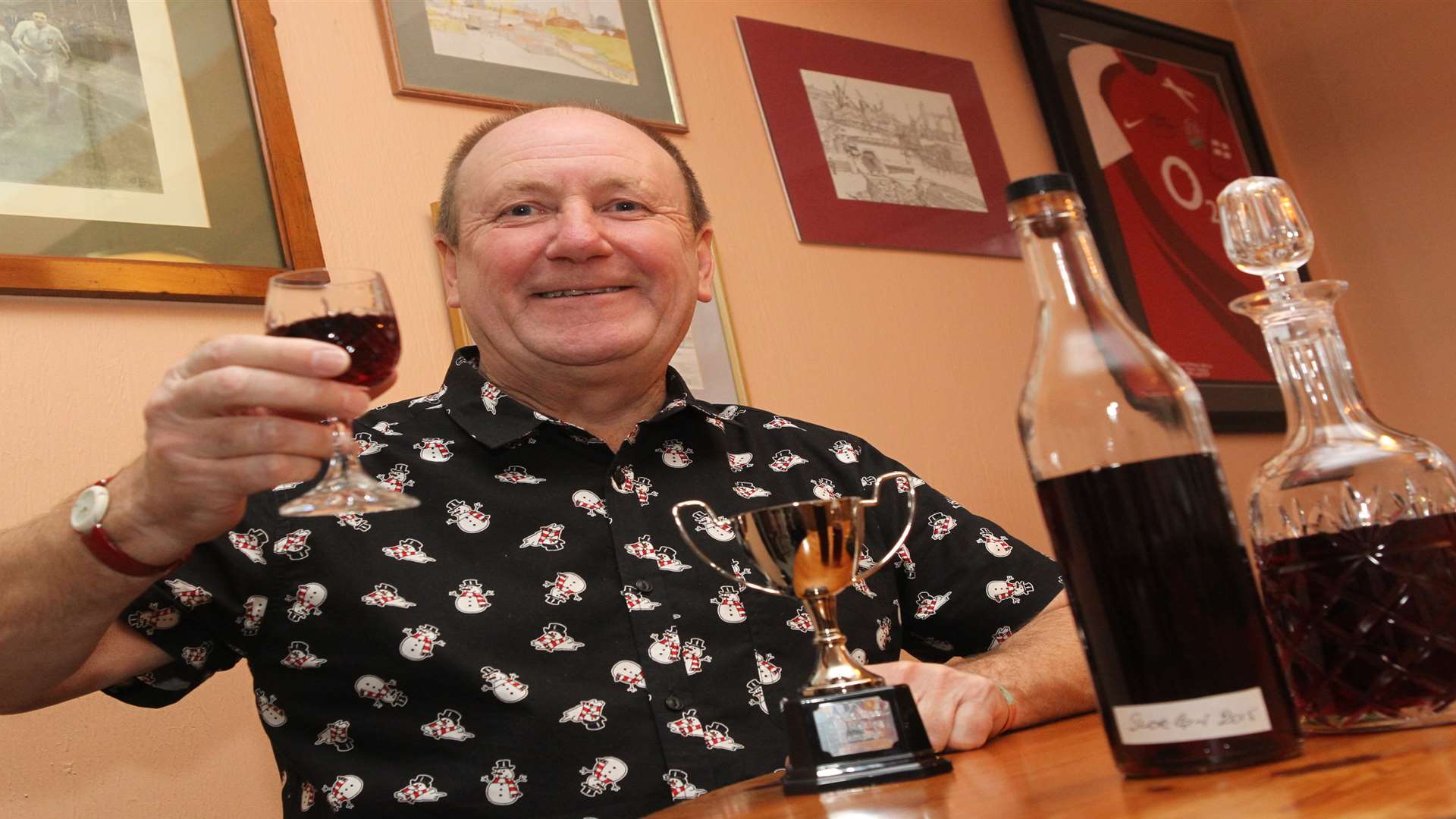 Kevin Ladley celebrates with a glass after wining the World's Sloe Gin award.